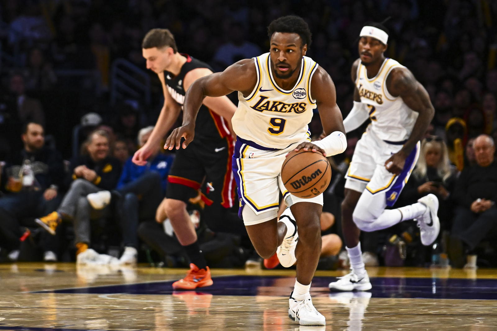 Los Angeles Lakers guard Bronny James (9) charges the net against the Miami Heat during the second half at Crypto.com Arena. Jonathan Hui-Imagn Images