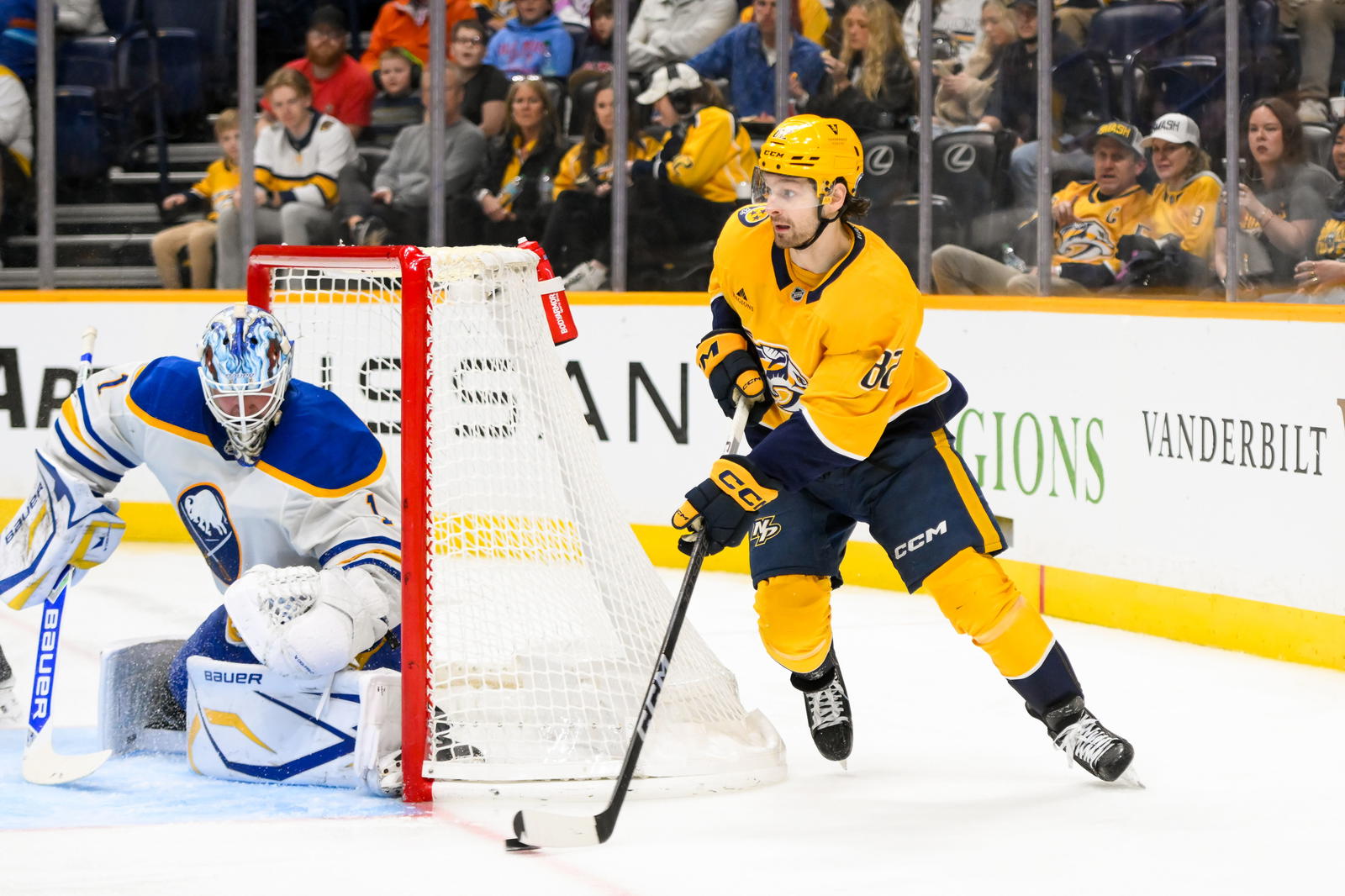 Feb 8, 2025; Nashville, Tennessee, USA; Nashville Predators center Tommy Novak (82) skates behind the net against the Buffalo Sabres during the third period at Bridgestone Arena. Mandatory Credit: Steve Roberts-Imagn Images