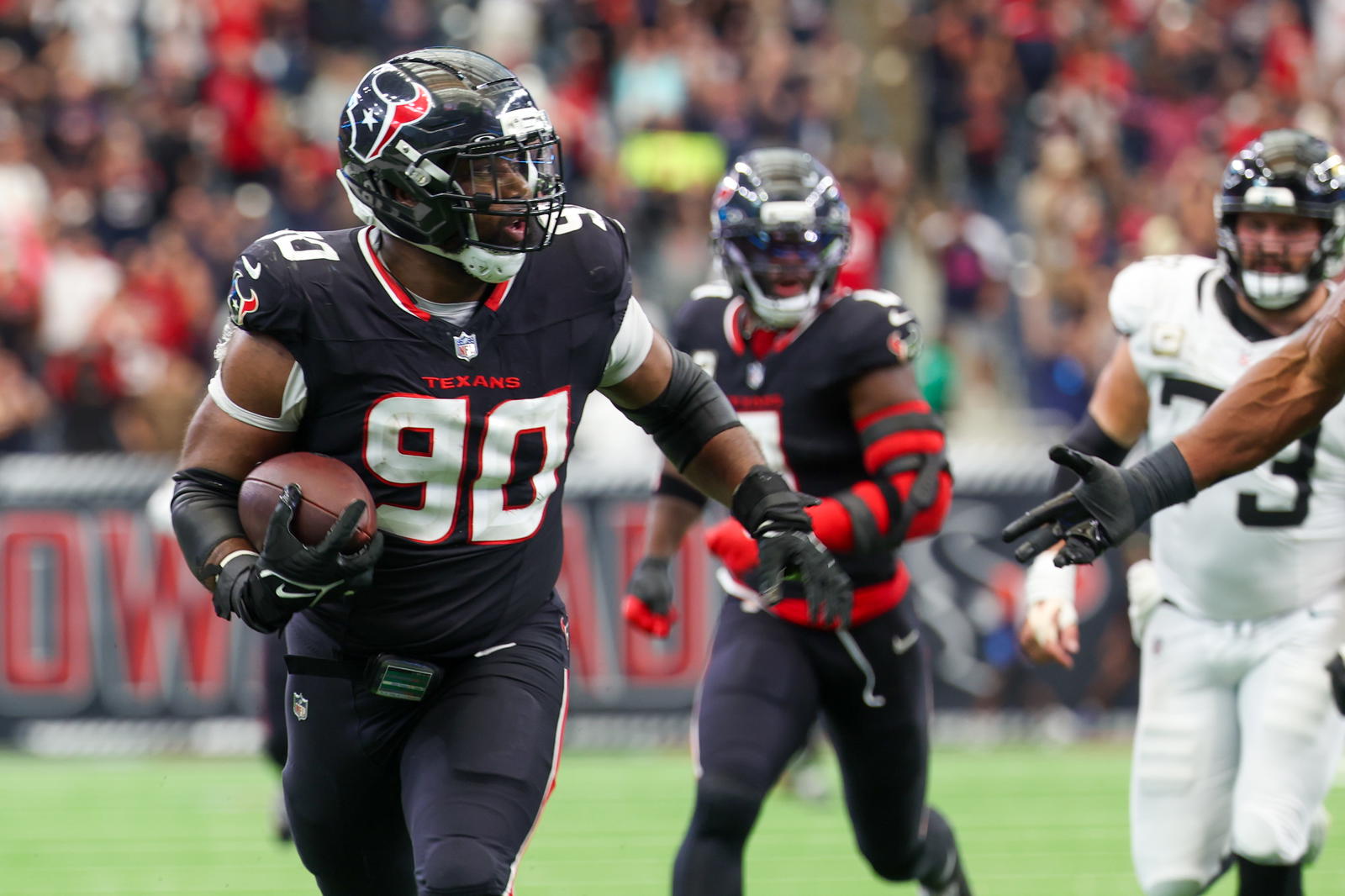 Texans Defensive Lineman Sheldon Rankins Rumbled 32 Yards For The Touchdown To End The Game. Photo - Thomas Shea/Imagn Images