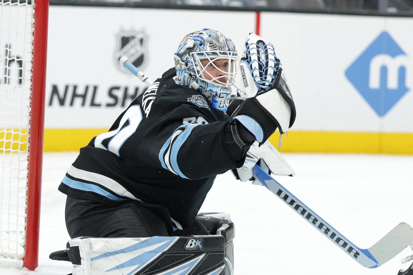 Jan 31, 2025; Salt Lake City, Utah, USA; Utah Hockey Club goaltender Karel Vejmelka (70) catches the puck during the first period against the Columbus Blue Jackets at Delta Center. Mandatory Credit: Chris Nicoll-Imagn Images