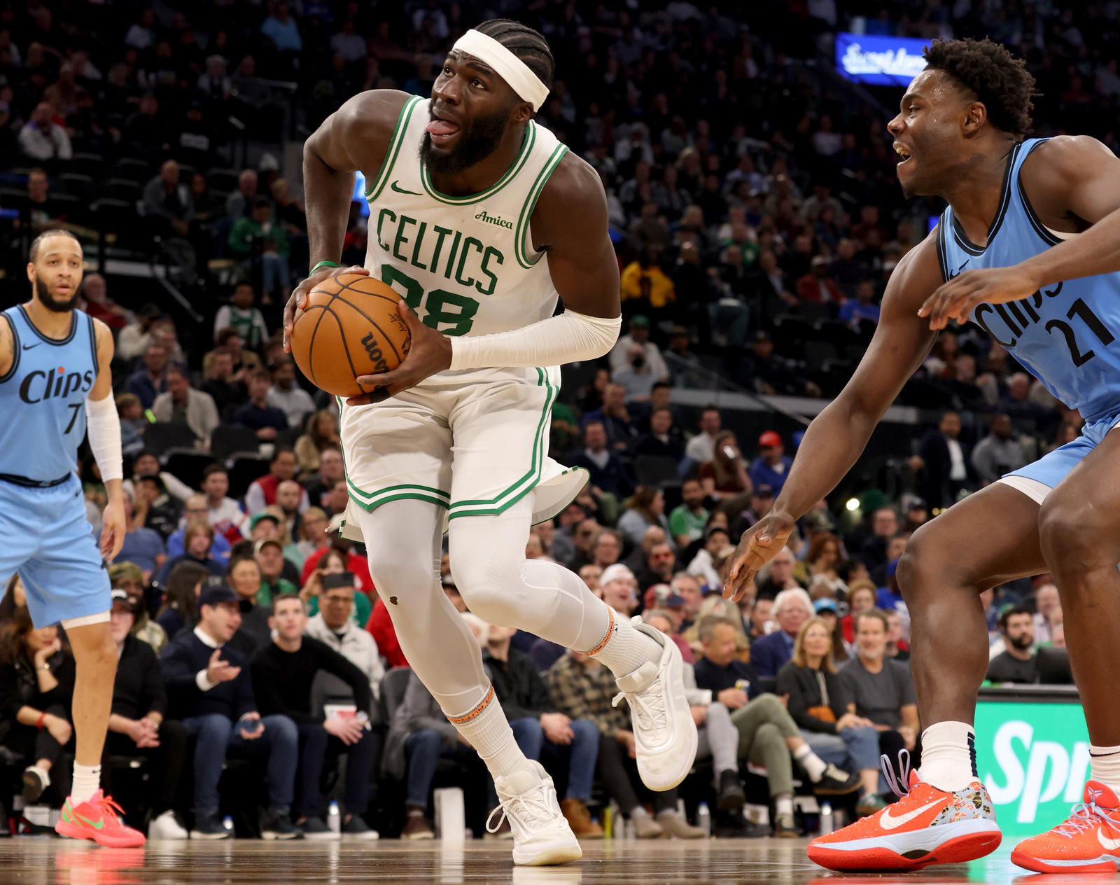 Jan 22, 2025; Inglewood, California, USA; Boston Celtics center Neemias Queta (88) drives against LA Clippers guard Kobe Brown (21) during the third quarter at Intuit Dome. (Jason Parkhurst/Imagn Images)
