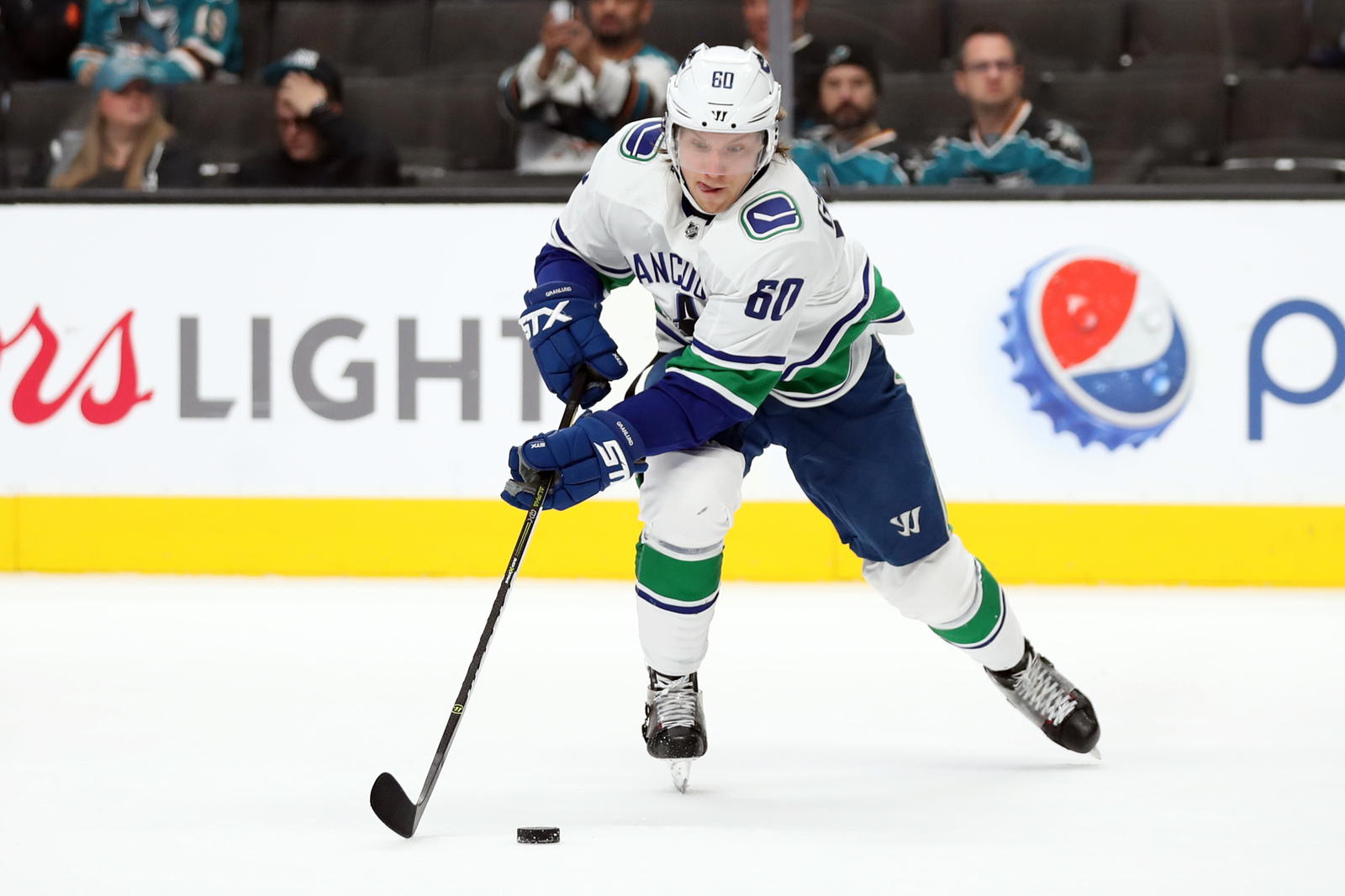Nov 23, 2018; San Jose, CA, USA; Vancouver Canucks center Markus Granlund (60) controls the puck during the third period against the San Jose Sharks at SAP Center at San Jose. Mandatory Credit: Darren Yamashita-Imagn Images