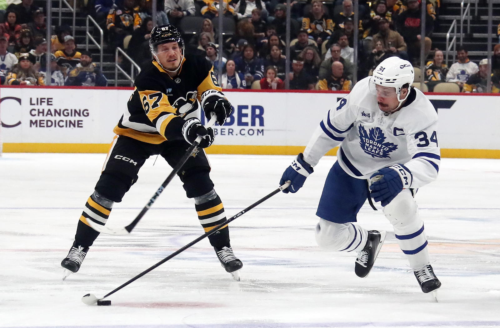 Rickard Rakell and Auston Matthews (Charles LeClaire-Imagn Images)