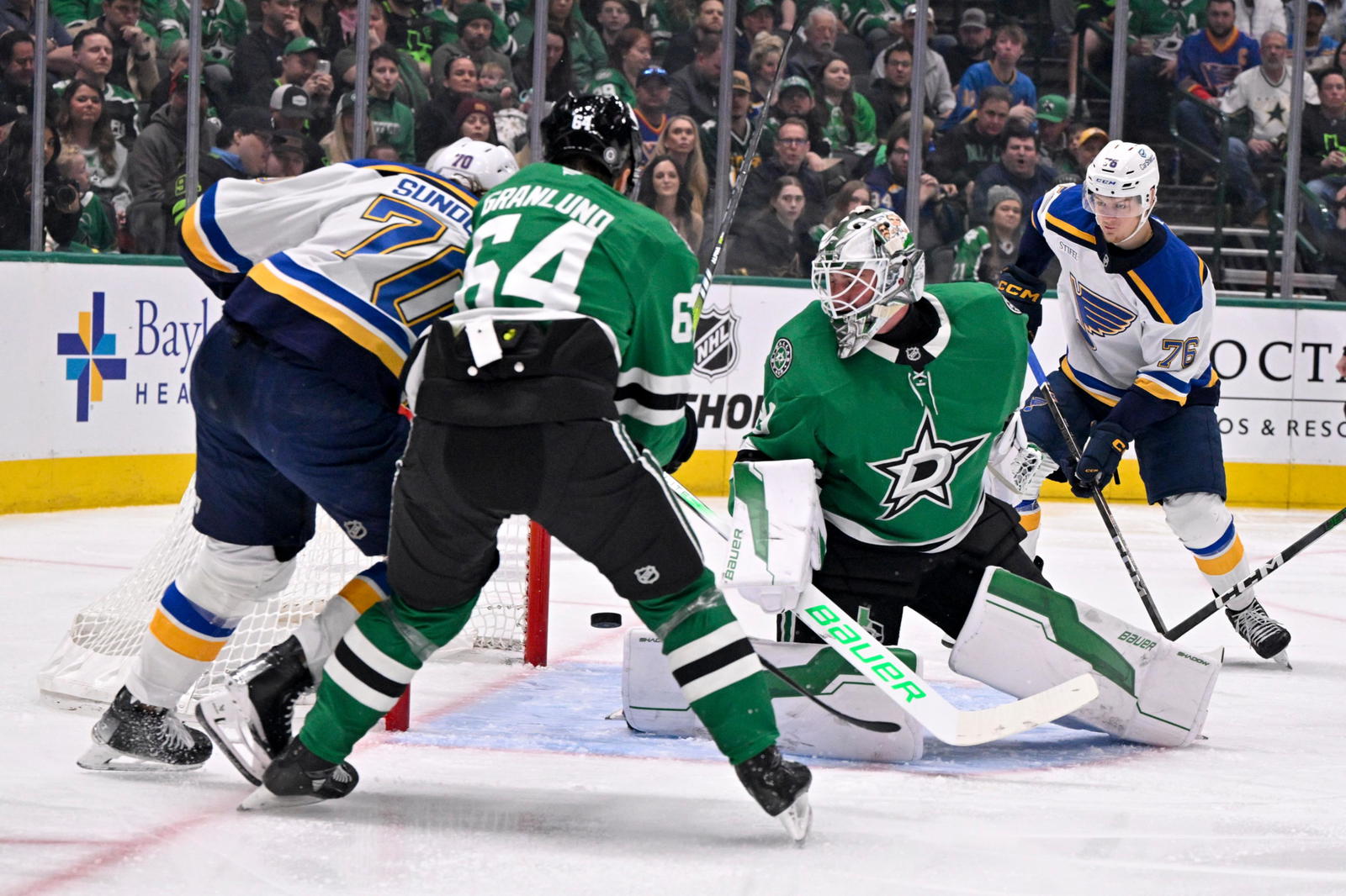 Zack Bolduc (76) locates a loose puck and scored the first goal of the game for the St. Louis Blues on Sunday. (Jerome Miron-Imagn Images)