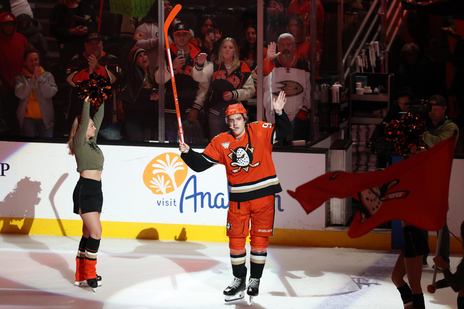 Nov 9, 2025; Anaheim, California, USA; Anaheim Ducks center Leo Carlsson (91) waves to fans as he is named Second Star of the Game against the Winnipeg Jets at Honda Center. Mandatory Credit: Kiyoshi Mio-Imagn Images