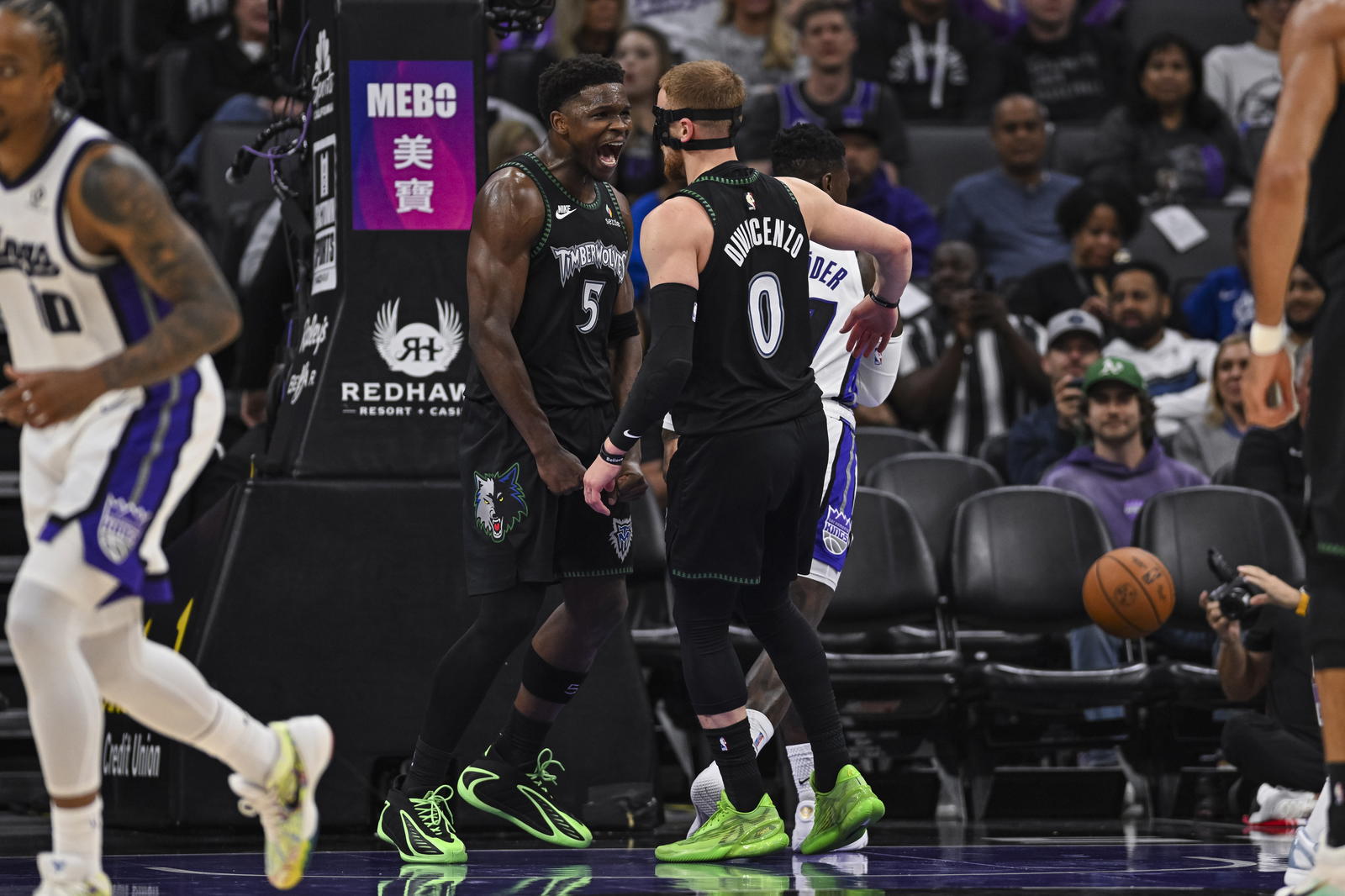 Minnesota Timberwolves guard Anthony Edwards (5) and guard Donte DiVincenzo (0) react during the second quarter at Golden 1 Center. Justine Willard-Imagn Images