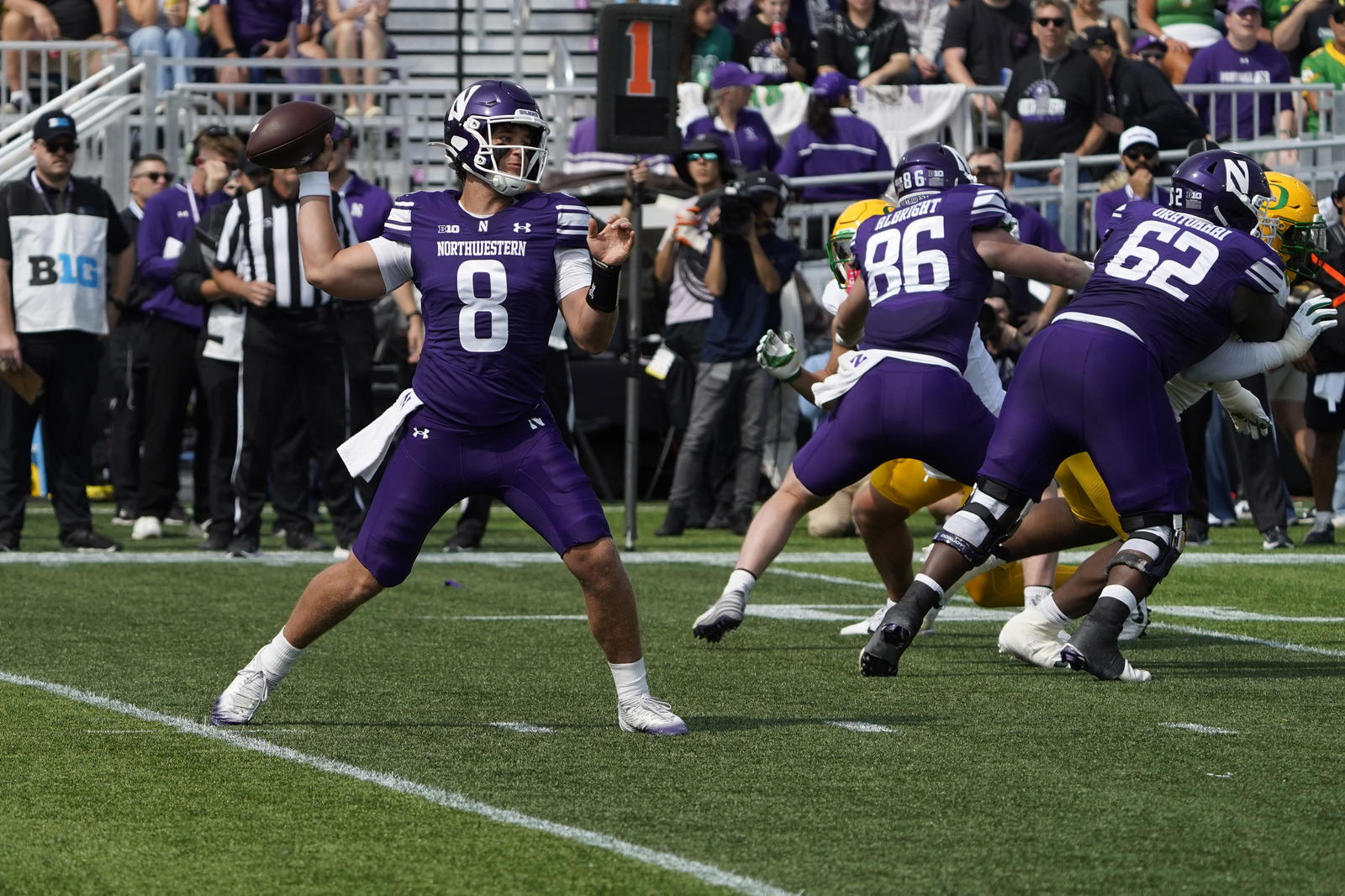 Sep 13, 2025; Evanston, Illinois, USA; Northwestern Wildcats quarterback Preston Stone (8) throws the ball against the Oregon Ducks during the first half at Northwestern Medicine Field at Martin Stadium. Mandatory Credit: David Banks-Imagn Images