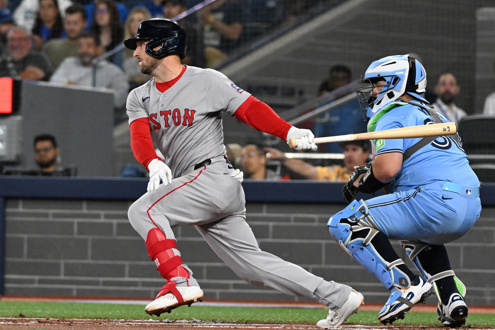 Boston Red Sox third baseman Alex Bregman (2) hits a single against the Toronto Blue Jays in the first inning at Rogers Centre. Dan Hamilton-Imagn Images