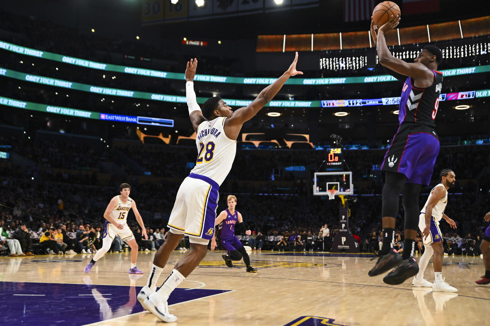 Los Angeles Lakers forward Rui Hachimura (28) attempts to block a shot from Toronto Raptors guard RJ Barrett (9) during the second half at Crypto.com Arena. Jonathan Hui-Imagn Images