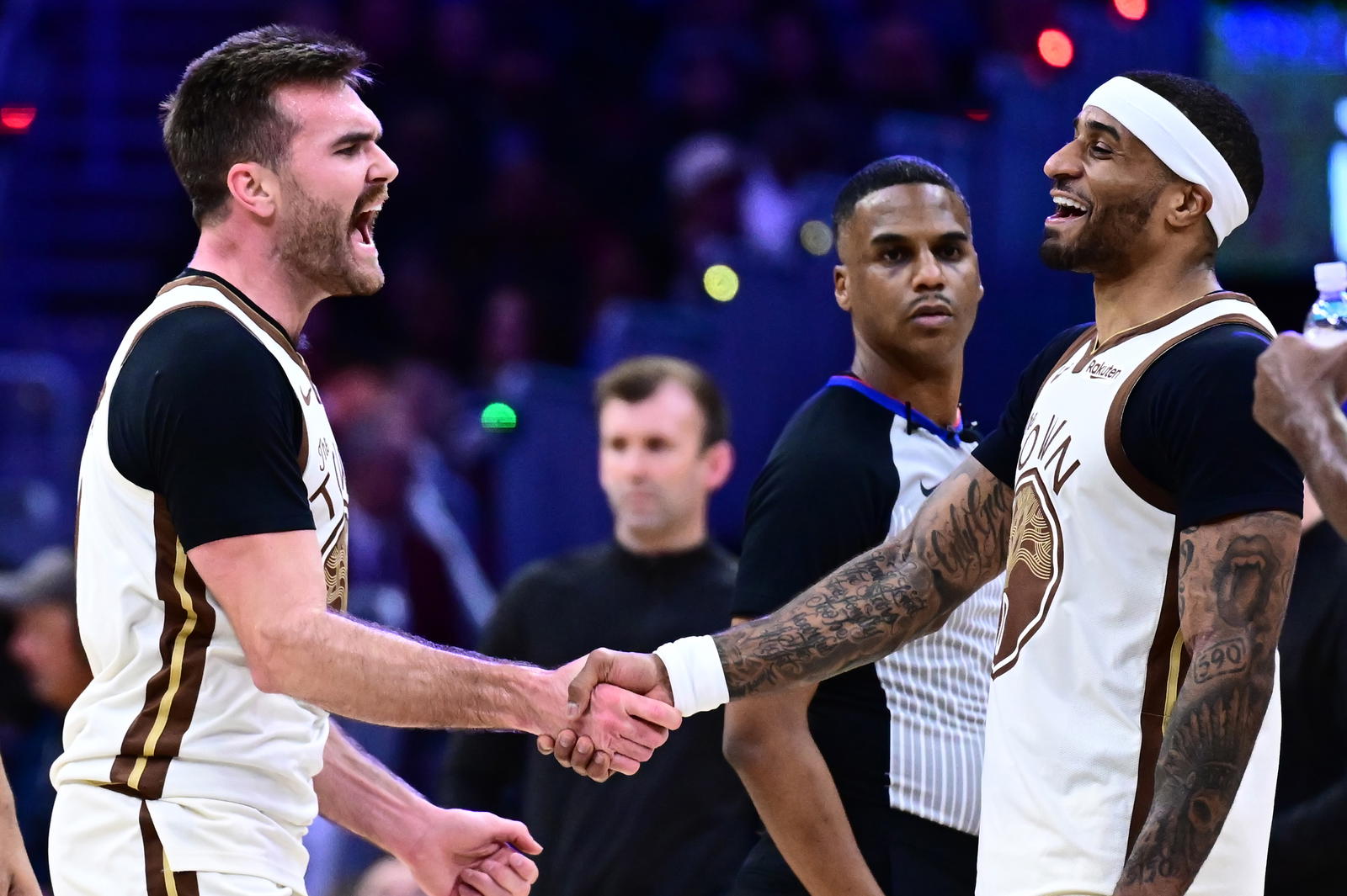 Dec 6, 2025; Cleveland, Ohio, USA; Golden State Warriors guard Pat Spencer (61) celebrates with guard Gary Payton II (0) against the Cleveland Cavaliers during the second half at Rocket Arena. Mandatory Credit: Ken Blaze-Imagn Images