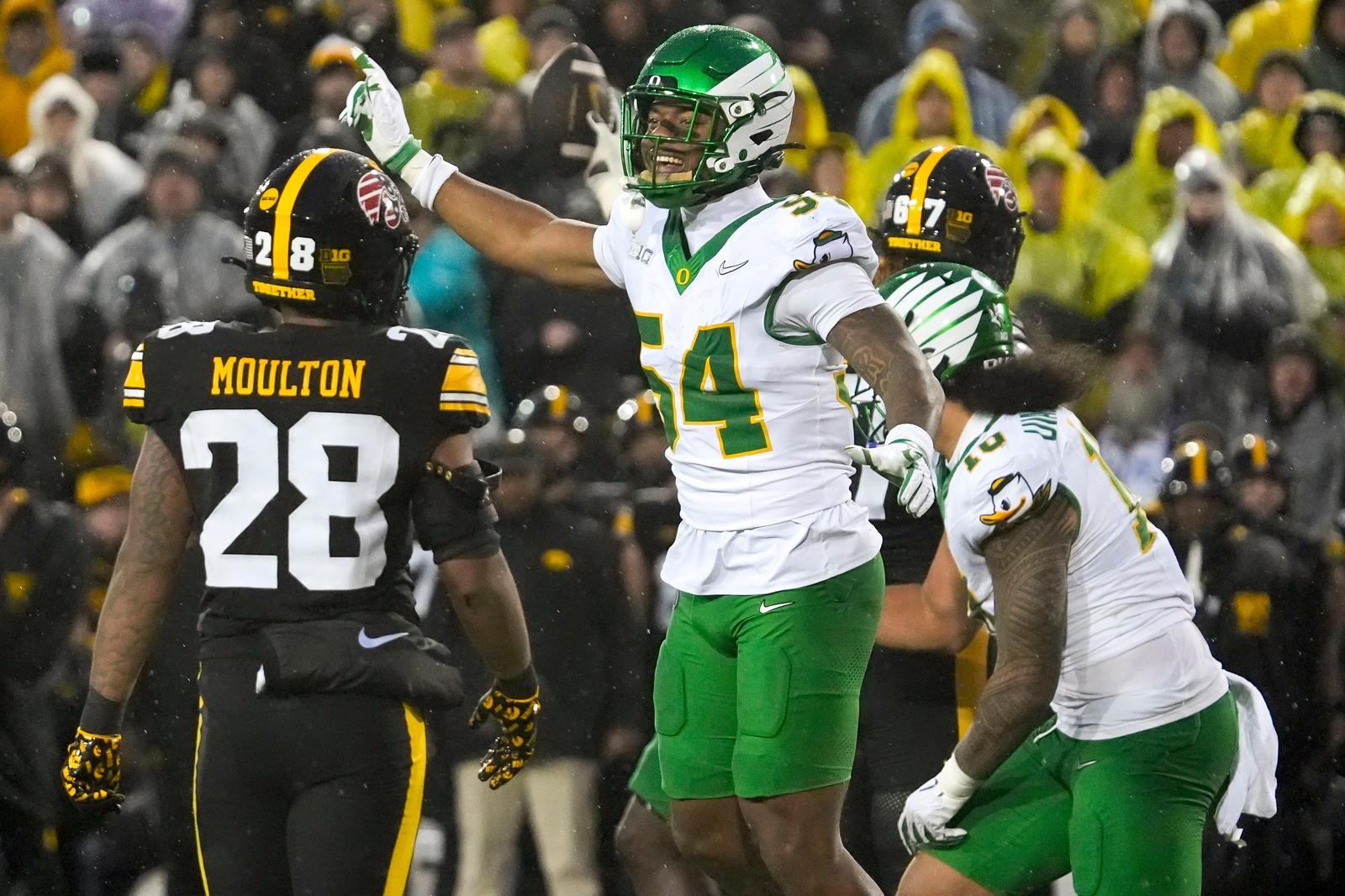 Oregon Ducks linebacker Jerry Mixon (54) singles first down for the Ducks after an Iowa Hawkeyes wide receiver Kaden Wetjen (21) fumble Nov. 8, 2025 during a Big Ten Football game at Kinnick Stadium in Iowa City, Iowa.<br>Julia Hansen/Iowa City Press-Citizen / USA TODAY NETWORK via Imagn Images