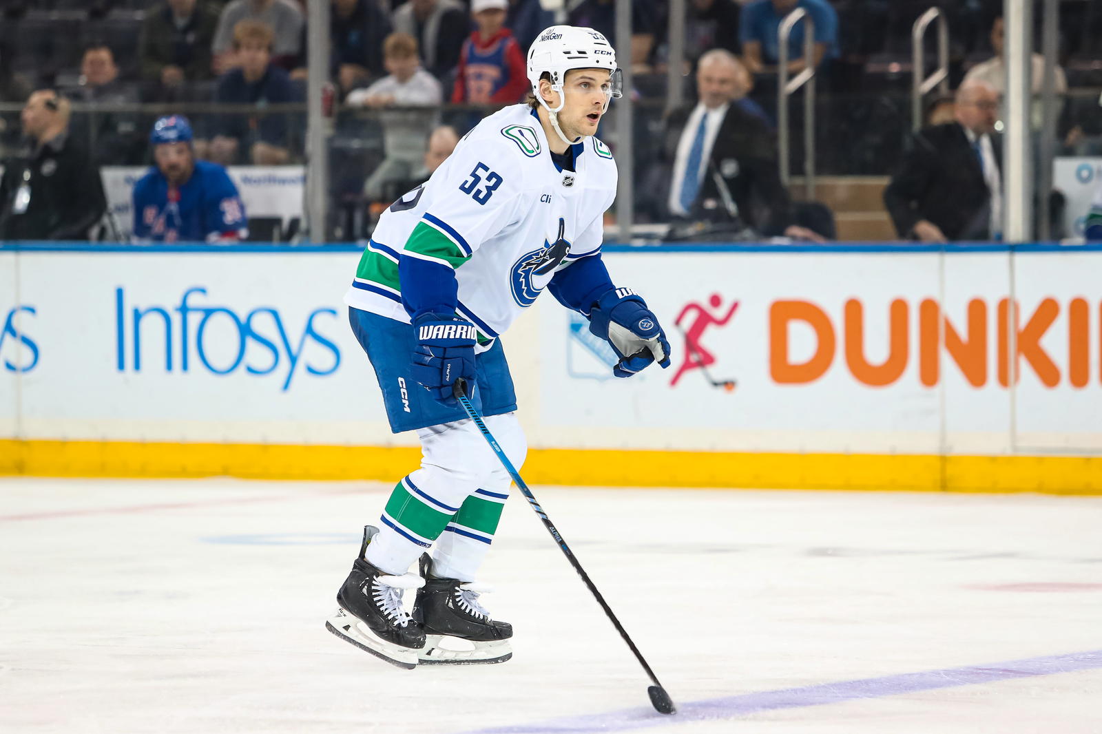 Mar 22, 2025; New York, New York, USA; Vancouver Canucks center Teddy Blueger (53) skates against the New York Rangers during the second period at Madison Square Garden. Mandatory Credit: Danny Wild-Imagn Images
