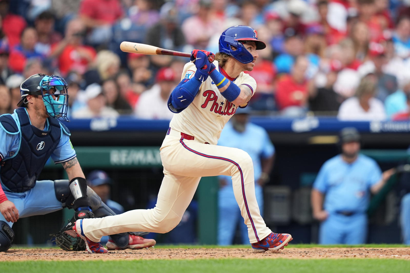 Jun 14, 2025; Philadelphia, Pennsylvania, USA; Philadelphia Phillies infielder Bryson Stott (5) hits a single against the Toronto Blue Jays in the sixth inning at Citizens Bank Park. Mandatory Credit: Kyle Ross-Imagn Images