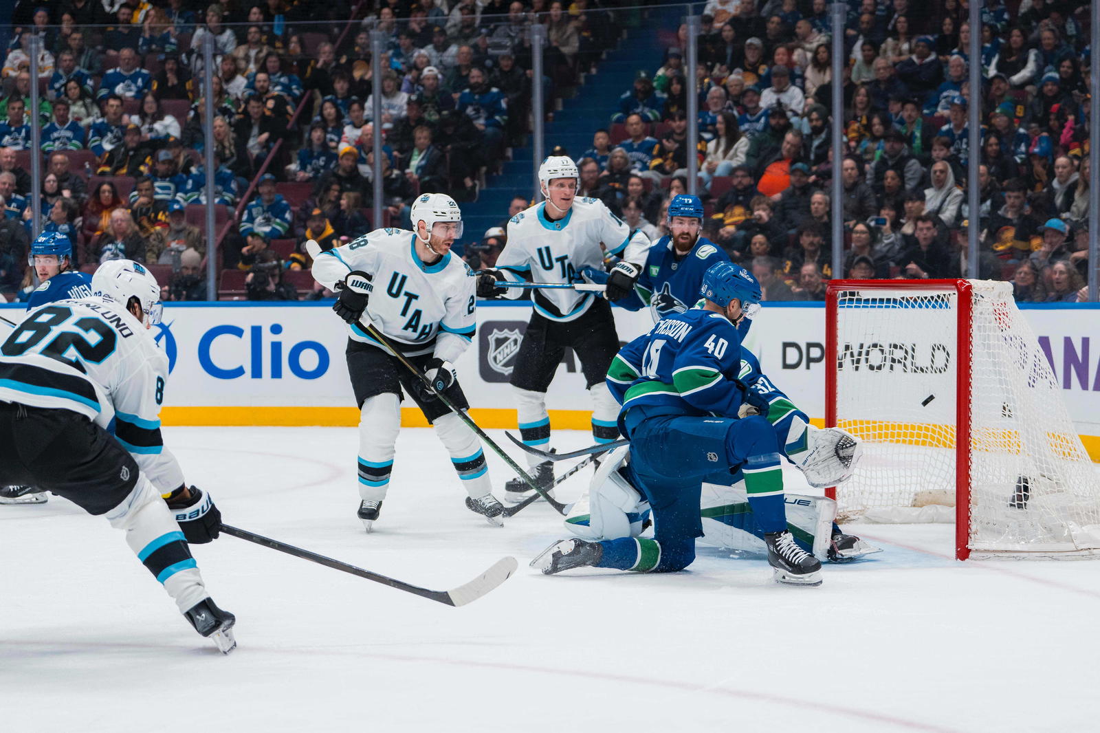 Mar 16, 2025; Vancouver, British Columbia, CAN; Utah Hockey Club defenseman Ian Cole (28) and forward Nick Bjugstad (17) and Vancouver Canucks defenseman Filip Hronek (17) and forward Elias Pettersson (40) and goalie Kevin Lankinen (32) watch as forward Kevin Stenlund (82) scores in the second period at Rogers Arena. Mandatory Credit: Bob Frid-Imagn Images