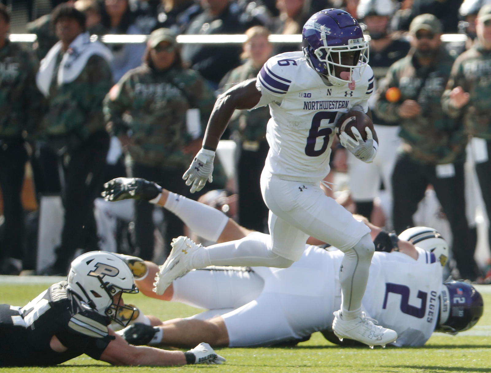 Northwestern Wildcats running back Joseph Himon II (6) breaks the tackle of Purdue Boilermakers defensive back Dillon Thieneman (31) Saturday, Nov. 2, 2024, during the NCAA football game at Ross-Ade Stadium in West Lafayette, Ind.