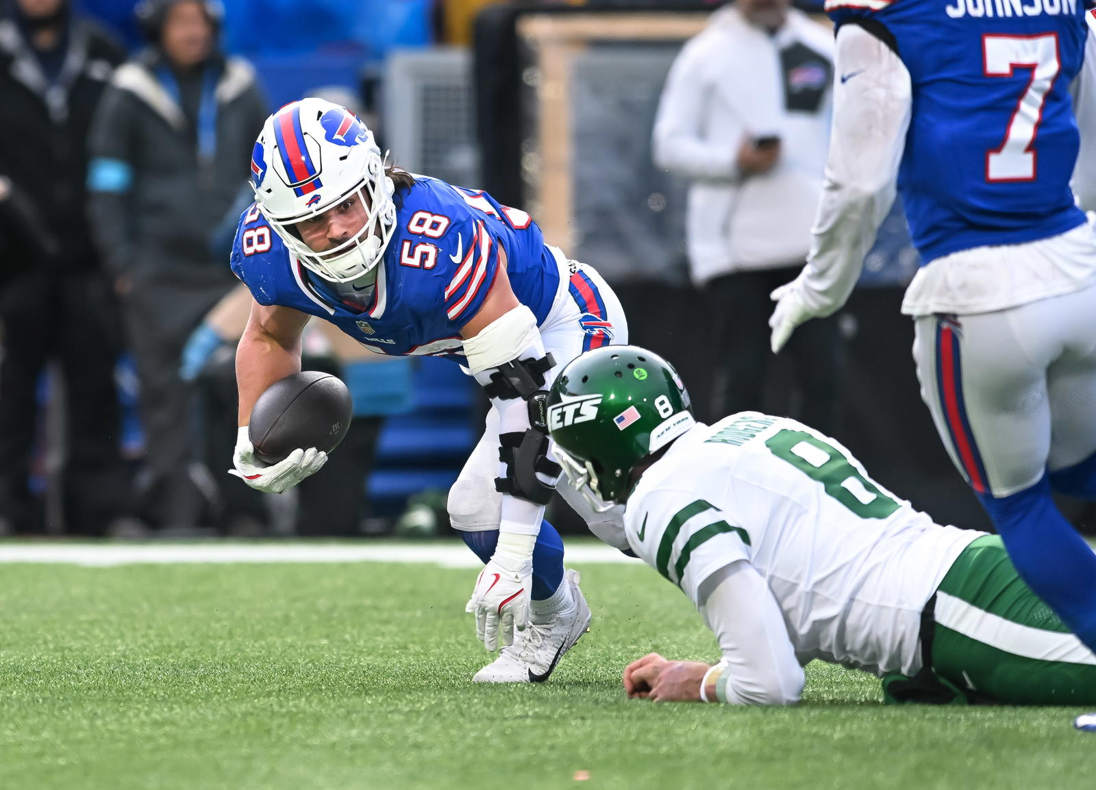 Buffalo Bills linebacker Matt Milano (58) recovers a fumble by the New York Jets in the third quarter against the New York Jets at Highmark Stadium. Mark Konezny/Imagn Images