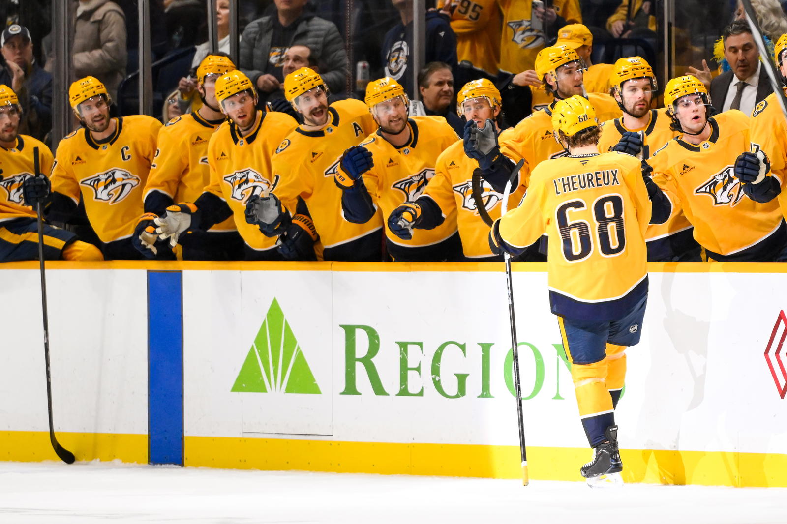 Dec 21, 2024; Nashville, Tennessee, USA; Nashville Predators left wing Zachary L'Heureux (68) celebrates his goal with his teammates against the Los Angeles Kings during the first period at Bridgestone Arena. Mandatory Credit: Steve Roberts-Imagn Images