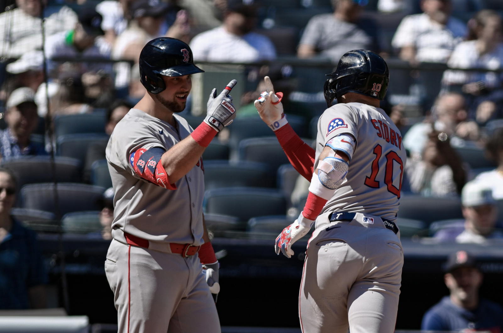 Aug 23, 2025; Bronx, New York, USA; Boston Red Sox shortstop Trevor Story (10) is greeted at home plate by first baseman Nathaniel Lowe (37) after hitting a solo home run against the New York Yankees during the fifth inning at Yankee Stadium. (John Jones/Imagn Images)