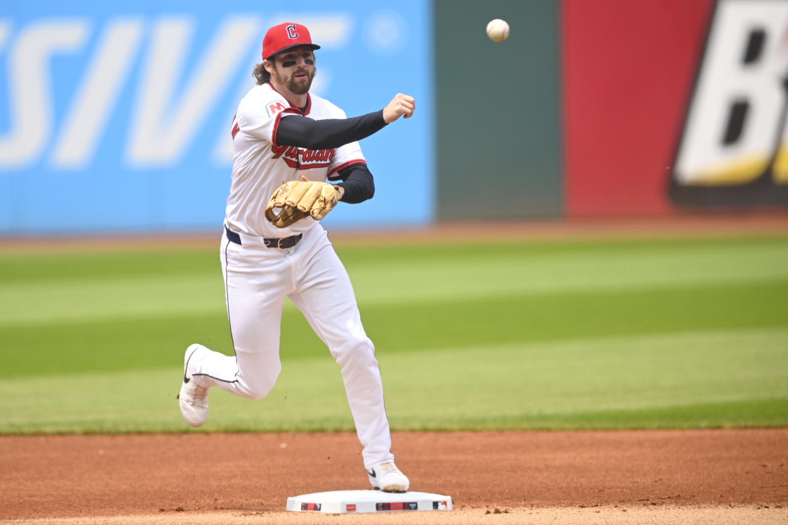 Jun 1, 2025; Cleveland, Ohio, USA; Cleveland Guardians second baseman Daniel Schneemann (10) turns a double play in the first inning against the Los Angeles Angels at Progressive Field. Mandatory Credit: David Richard-Imagn Images
