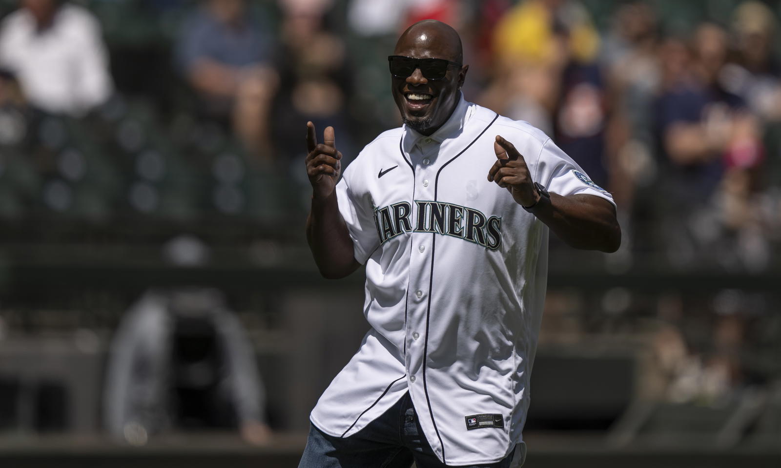 Former Seattle Mariners outfielder Mike Cameron reacts after throwing out the ceremonial first pitch before a game against the Houston Astros on July 28, 2021, at T-Mobile Park. - Stephen Brashear/Imagn Images