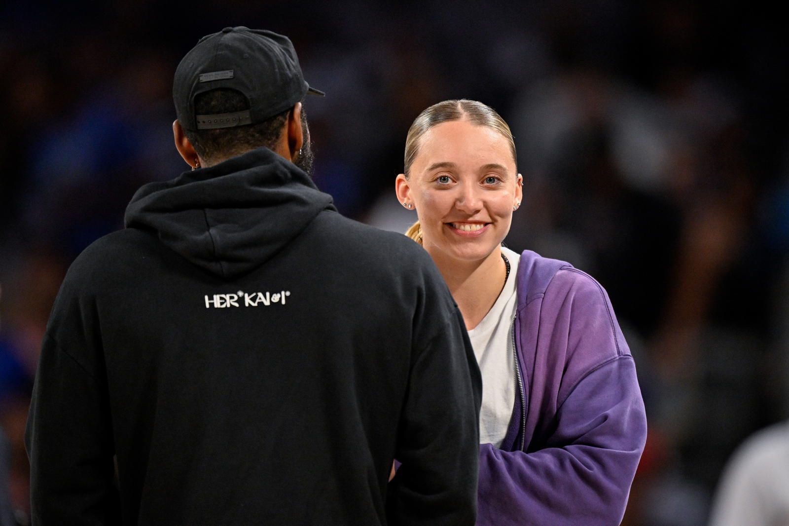 &nbsp;Dallas Mavericks guard Kyrie Irving (left) talks with Dallas Wings guard Paige Bueckers (right) during the second half of the game between the Mavericks and the Oklahoma City Thunder at Dickie's Arena. Jerome Miron-Imagn Images
