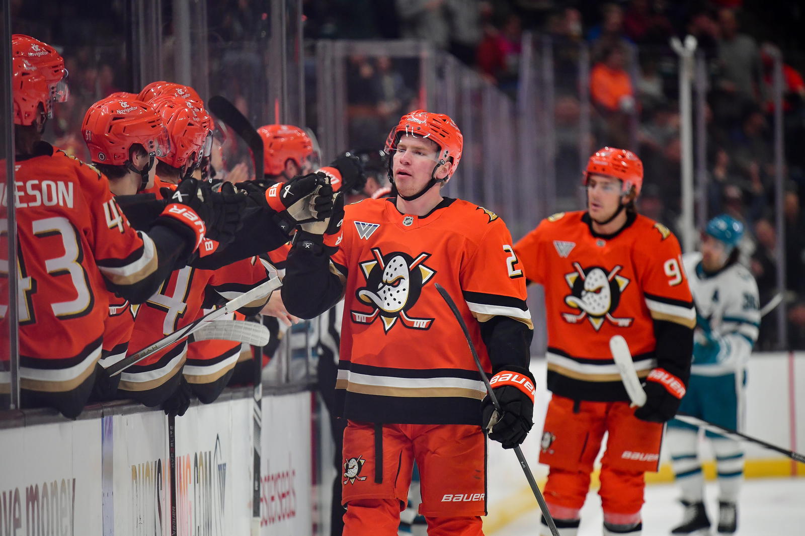 Apr 1, 2025; Anaheim, California, USA; Anaheim Ducks defenseman Jackson LaCombe (2) celebrates his power play goal scored against the San Jose Sharks during the first period at Honda Center. Mandatory Credit: Gary A. Vasquez-Imagn Images