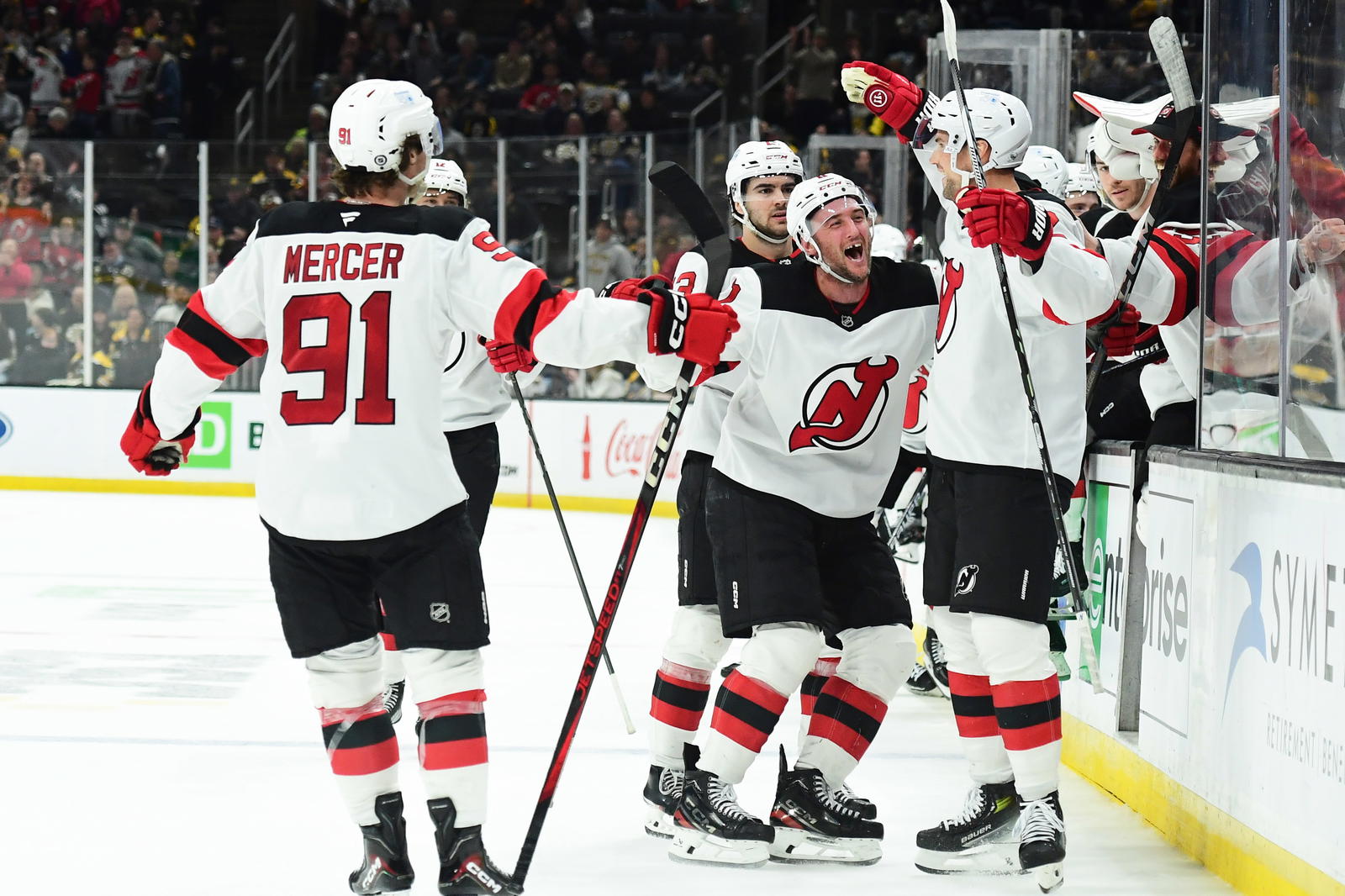 Apr 15, 2025; Boston, Massachusetts, USA; New Jersey Devils right wing Stefan Noesen (11) reacts with defenseman Brian Dumoulin (2) after Dumoulin scored the winning goal in overtime against the Boston Bruins at TD Garden. Mandatory Credit: Bob DeChiara-Imagn Images