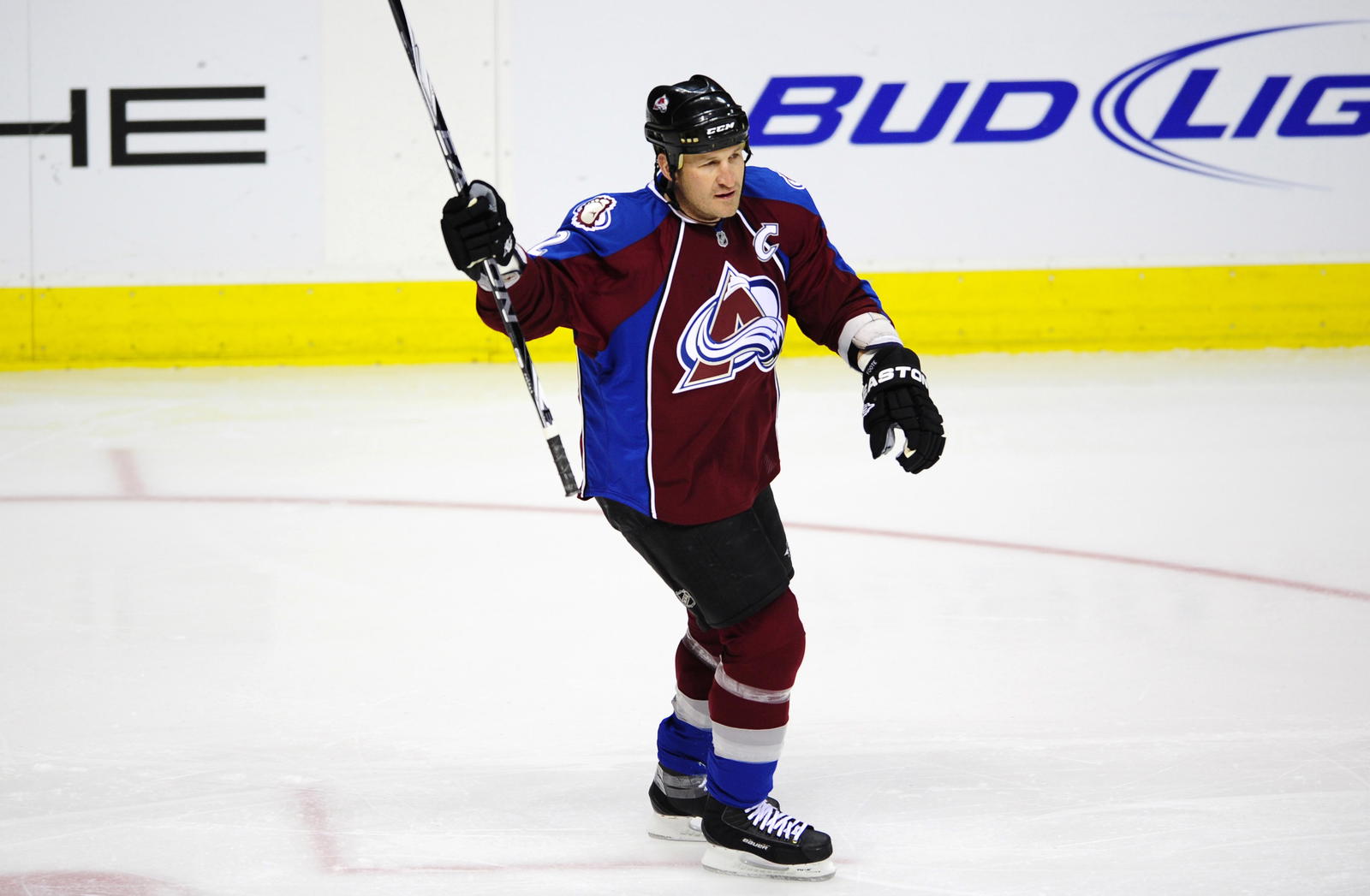 April 10 2011; Denver, CO, USA; Colorado Avalanche defenseman Adam Foote (52) reacts after Colorado Avalanche center Ryan O'Reilly (not pictured) scored a first period goal against the Edmonton Oilers at the Pepsi Center. Mandatory Credit: Ron Chenoy-Imagn Images