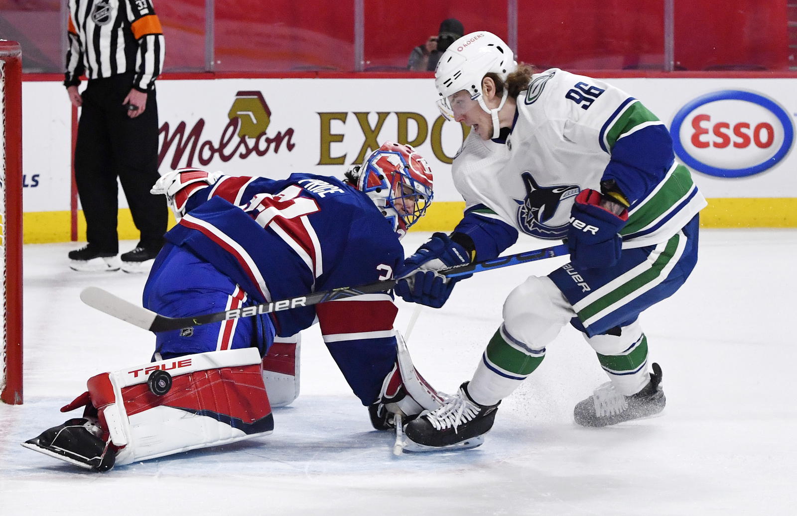 Mar 20, 2021; Montreal, Quebec, CAN; Montreal Canadiens goalie Carey Price (31) stops Vancouver Canucks forward Adam Gaudette (96) during the shootout period at the Bell Centre. Mandatory Credit: Eric Bolte-Imagn Images