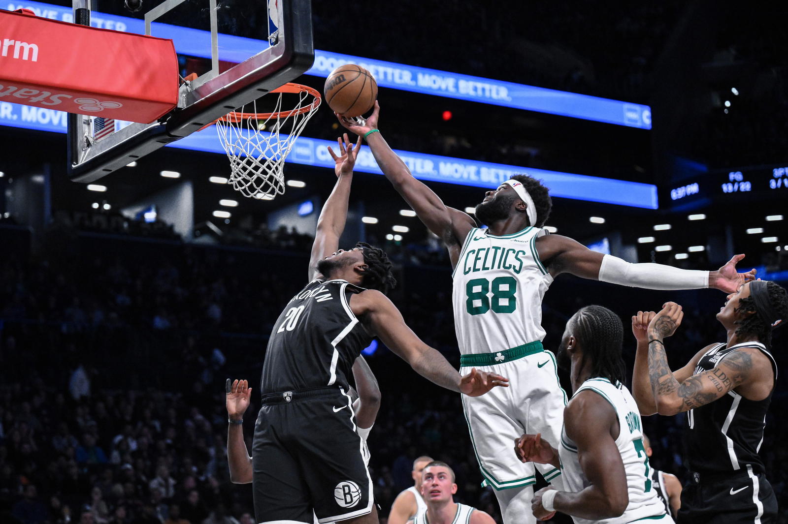 Mar 15, 2025; Brooklyn, New York, USA; Brooklyn Nets center Day'Ron Sharpe (20) and Boston Celtics center Neemias Queta (88) compete for a rebound during the first half at Barclays Center. (John Jones/Imagn Images)