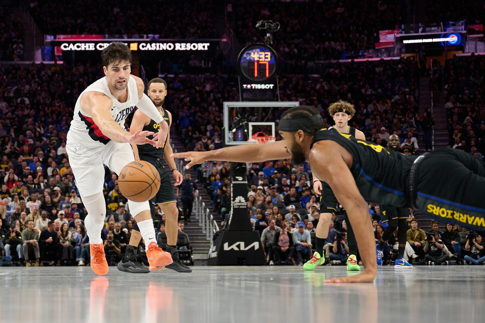 Golden State Warriors guard Moses Moody (4) extends for a loose ball against Portland Trail Blazers forward Deni Avdija (8) during the third quarter at Chase Center.&nbsp;Robert Edwards-Imagn Images
