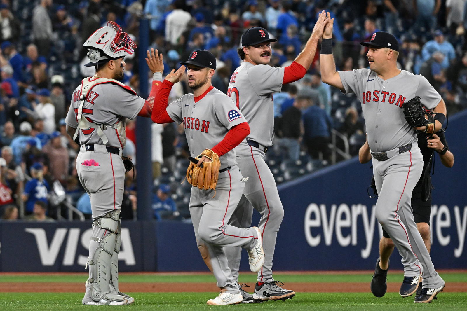 Boston Red Sox players celebrate a win. Credit: Dan Hamilton-Imagn Images.