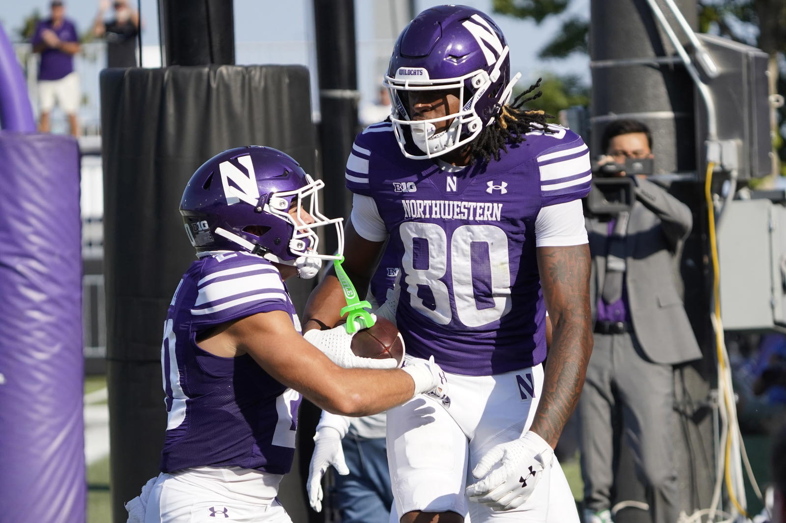 Oct 4, 2025; Evanston, Illinois, USA; Northwestern Wildcats wide receiver Hayden Eligon II (80) catches a touchdown pass against the ULM Warhawks during the first half at Northwestern Medicine Field at Martin Stadium. Mandatory Credit: David Banks-Imagn Images
