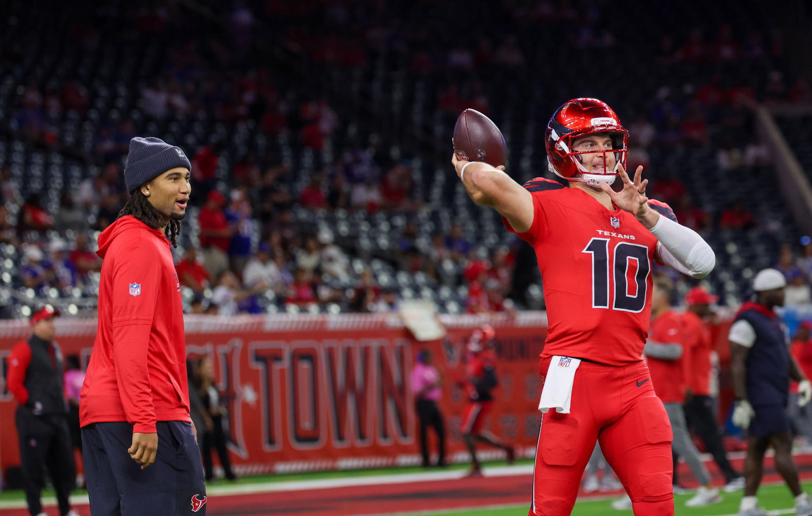 Nov 20, 2025; Houston, Texas, USA; Houston Texans quarterback C.J. Stroud (7) watches quarterback Davis Mills (10) warm up before playing against the Buffalo Bills at NRG Stadium. Mandatory Credit: Thomas Shea-Imagn Images