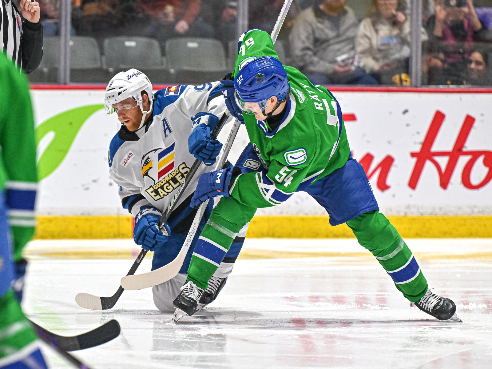Abbotsford Canucks' Aatu Räty (54) battles with Colorado Eagles' TJ Tynan. (Photo by @abbycanucks/X)