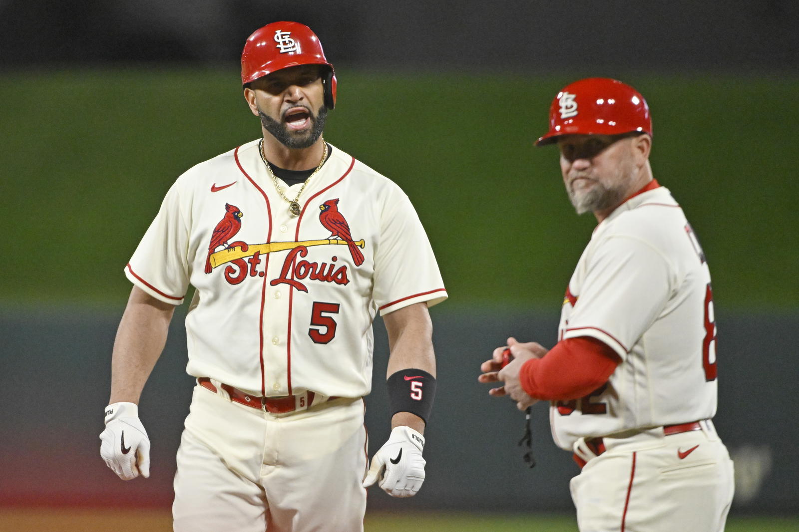 St. Louis Cardinals designated hitter Albert Pujols (5) reacts after his single in the eighth inning against the Philadelphia Phillies during game two of the Wild Card series for the 2022 MLB Playoffs at Busch Stadium. Jeff Curry-Imagn Images