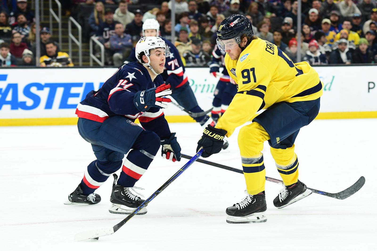 Feb 17, 2025; Boston, MA, USA; Team Sweden forward Leo Carlsson (91) controls the park while Team USA defenseman Brock Faber (14) defends during the second period in a 4 Nations Face-Off ice hockey game at TD Garden. Mandatory Credit: Bob DeChiara-Imagn Images