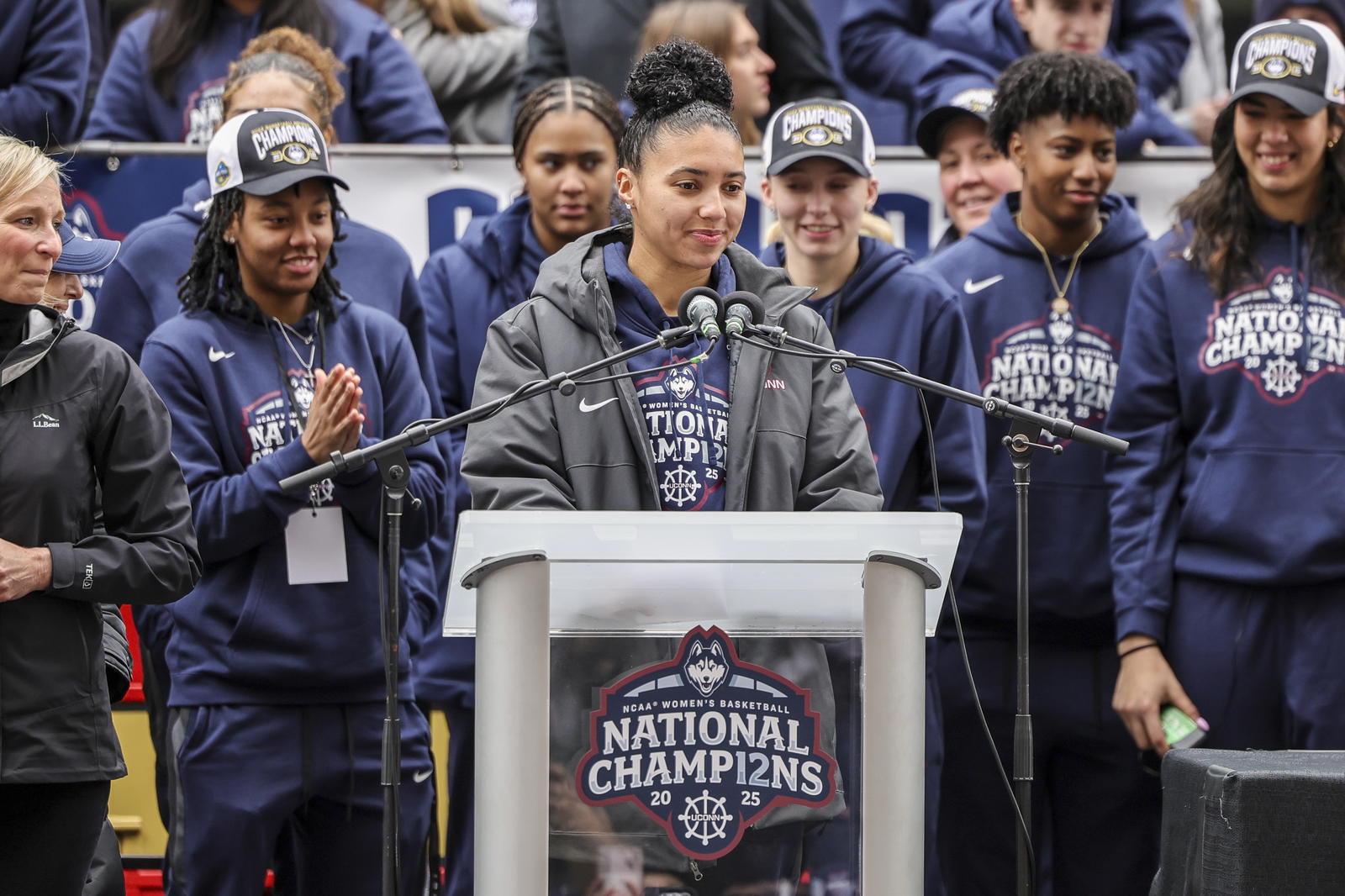 UConn student-athlete Azzi Fudd addresses the crowd while her teammates UConn student-athletes Paige Bueckers, KK Arnold, Sarah Strong and Ayanna Patterson look on during the Final Four champions victory parade and rally outside of the XL Center in Hartford, CT. Scott Rausenberger-Imagn Images