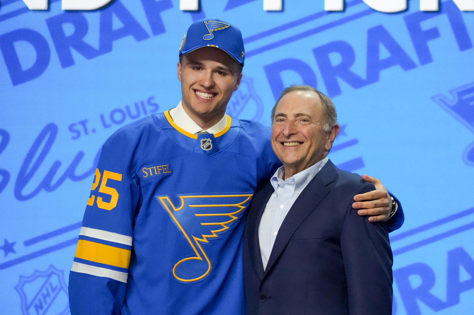 St. Louis Blues 2025 first-round pick Justin Carbonneau (left) poses with NHL Commissioner Gary Bettman in Los Angeles after being selected with the 19th pick. (Kirby Lee-Imagn Images)