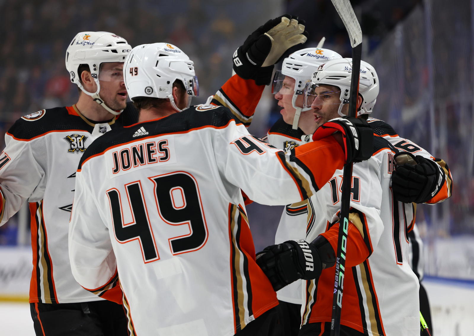 Feb 19, 2024; Buffalo, New York, USA; Anaheim Ducks center Adam Henrique (14) celebrates his goal with teammates during the first period against the Buffalo Sabres at KeyBank Center. Mandatory Credit: Timothy T. Ludwig-Imagn Images