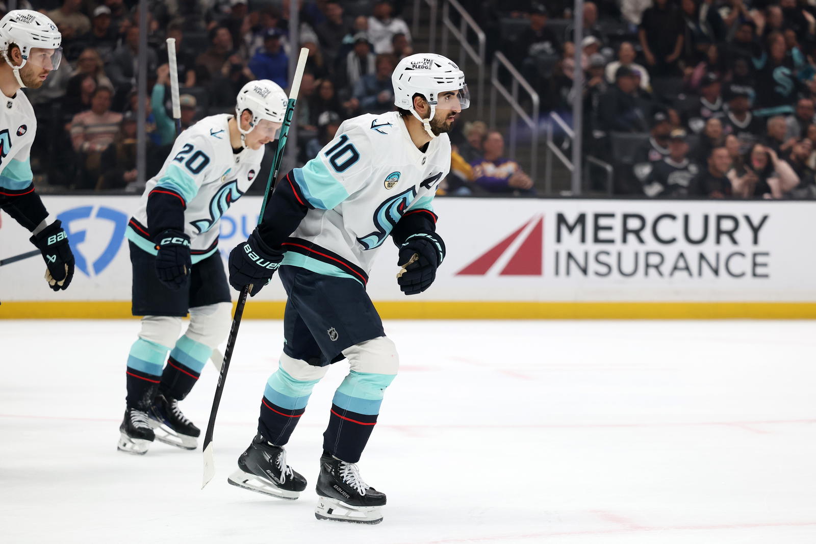 Seattle Kraken center Matty Beniers (10) skates back to the bench after scoring a goal during the first period against the Los Angeles Kings at Crypto.com Arena. Mandatory Credit: Kiyoshi Mio-Imagn Images