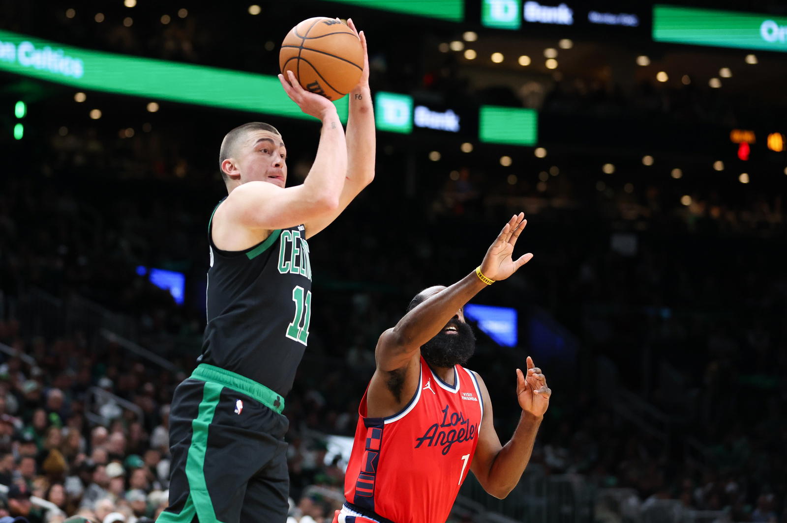 Nov 16, 2025; Boston, Massachusetts, USA; Boston Celtics guard Payton Pritchard (11) shoots during the first half against the Los Angeles Clippers at TD Garden. (Paul Rutherford/Imagn Images)