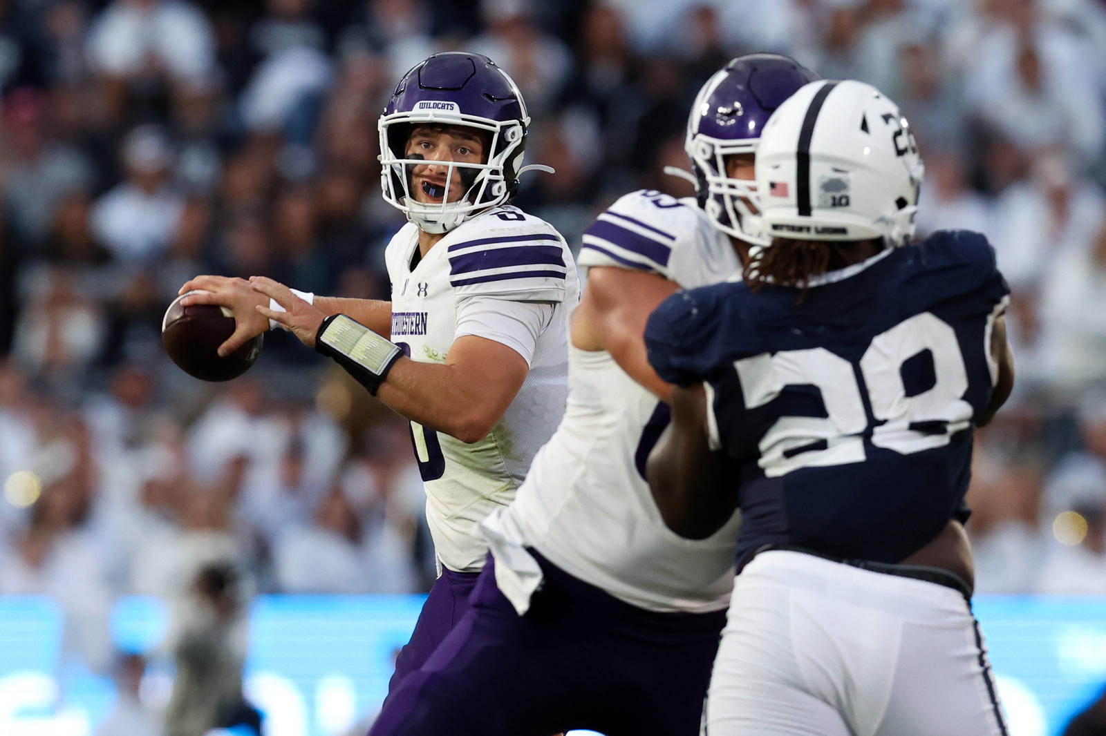 Oct 11, 2025; University Park, Pennsylvania, USA; Northwestern Wildcats quarterback Preston Stone (8) throws a pass during the fourth quarter against the Penn State Nittany Lions at Beaver Stadium. Mandatory Credit: Matthew O'Haren-Imagn Images