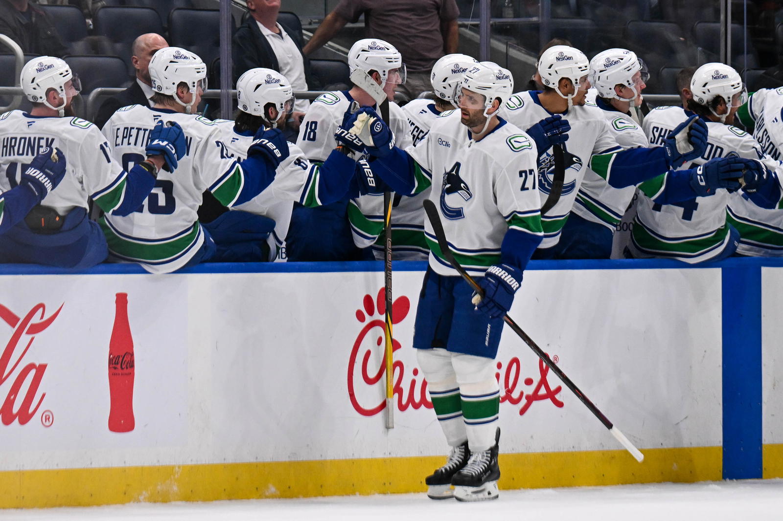 Mar 26, 2025; Elmont, New York, USA; Vancouver Canucks defenseman Derek Forbort (27) celebrates his goal against the New York Islanders during the second period at UBS Arena. Mandatory Credit: Dennis Schneidler-Imagn Images
