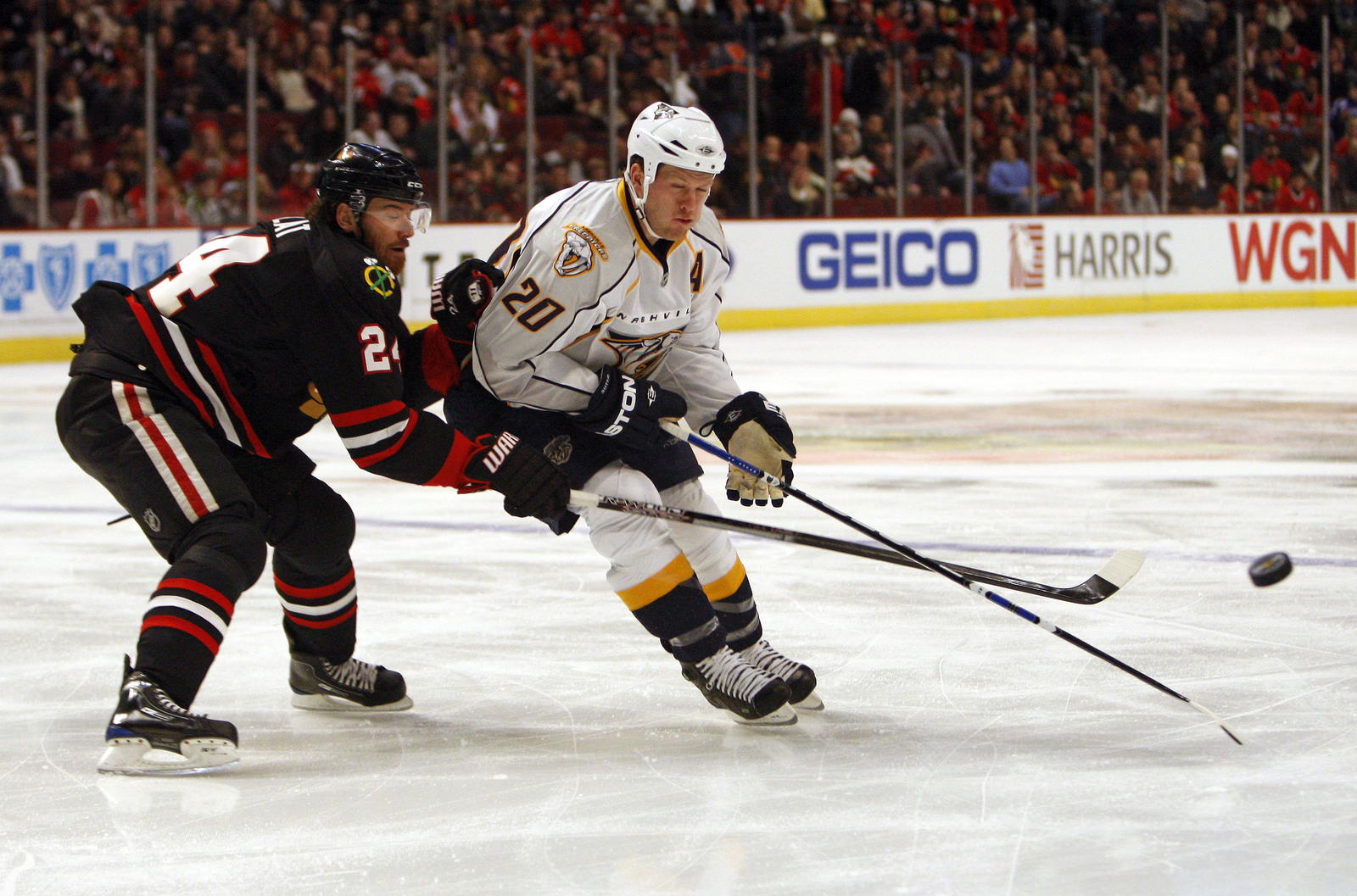 Jan 11, 2009, Chicago, IL, USA; Nashville Predators defenseman Ryan Suter (20) passes the puck away from Chicago Blackhawks right wing Martin Havlat (24) during the first period at the United Center. Mandatory Credit: Jerry Lai-Imagn Images