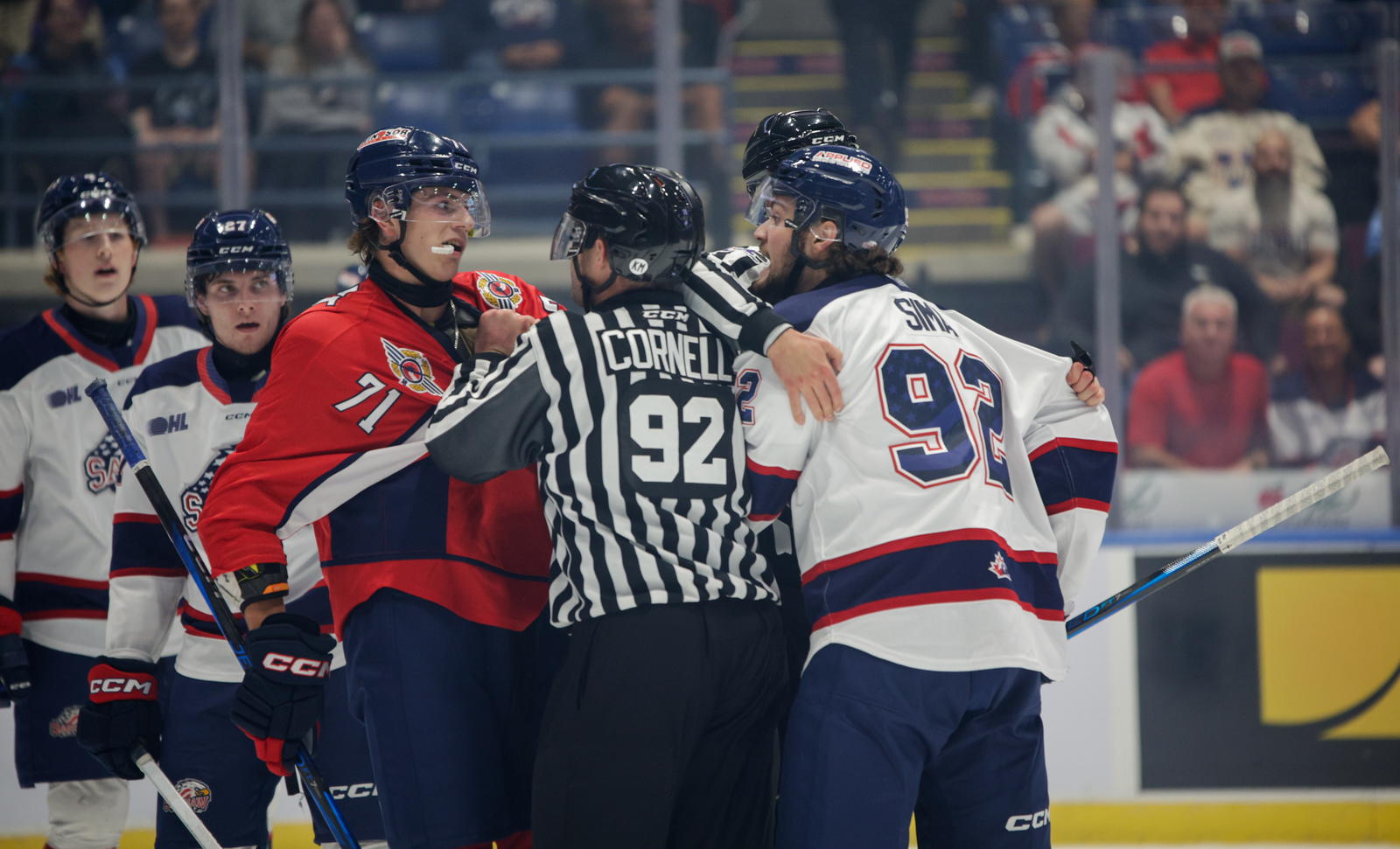 Saginaw Spirit forward Nic Sima and Windsor Spitfires forward Jack Nesbitt jaw at each other after the whistle during a game on Sept. 25, 2024. 