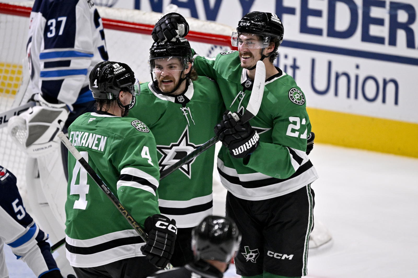 Dallas Stars center Sam Steel (18) and left wing Mason Marchment (27) and defenseman Miro Heiskanen (4) celebrates a goal scored by Steel against the Winnipeg Jets during the second period in game six of the second round of the 2025 Stanley Cup Playoffs at American Airlines Center. Mandatory Credit: Jerome Miron-Imagn Images
