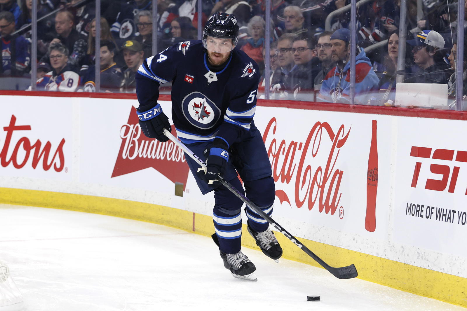 Winnipeg Jets defenseman Dylan Samberg (54) skates up the ice against the St. Louis Blues in the first period at Canada Life Centre. Mandatory Credit: James Carey Lauder-Imagn Images