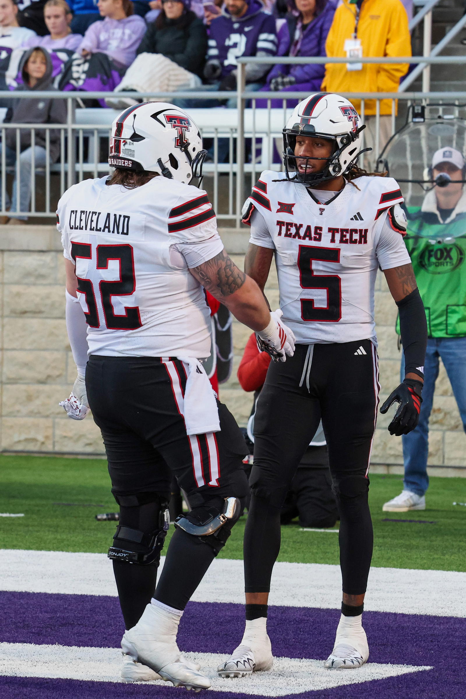 Texas Tech Red Raiders wide receiver Caleb Douglas (5) celebrates with offensive lineman Cash Cleveland (52) after scoring a touchdown in the fourth quarter against the Kansas State Wildcats at Bill Snyder Family Football Stadium.<br>Scott Sewell-Imagn Images