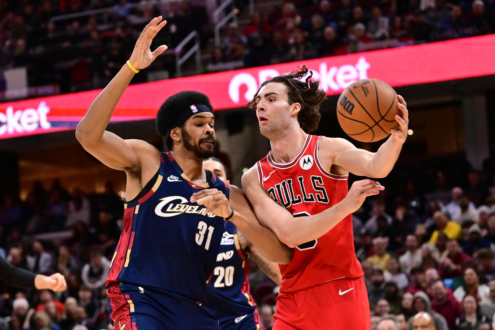 Nov 8, 2025; Cleveland, Ohio, USA; Chicago Bulls guard Josh Giddey (3) drives to the basket against Cleveland Cavaliers center Jarrett Allen (31) during the second half at Rocket Arena. Mandatory Credit: Ken Blaze-Imagn Images
